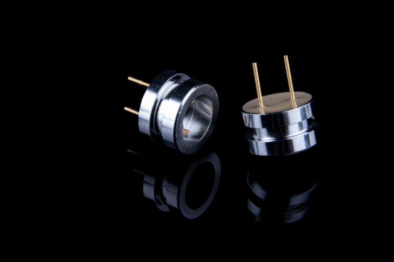 Pyrotechnic header with dual sealing technologies—glass-to-metal and GlassTomer™—for hermeticity in extreme environments.