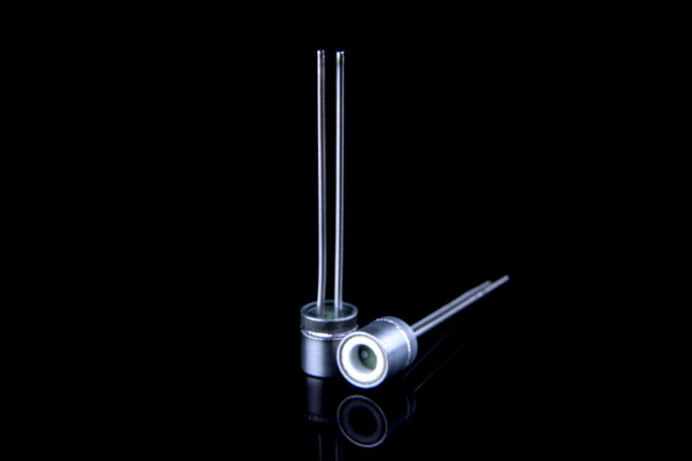 Pyrotechnical header, extreme fine surface finish and accurate flatness, by ceramic lapping. Nickel plating ready for laser/spot welding. Laser welded tube and extra ceramic insulator ring.